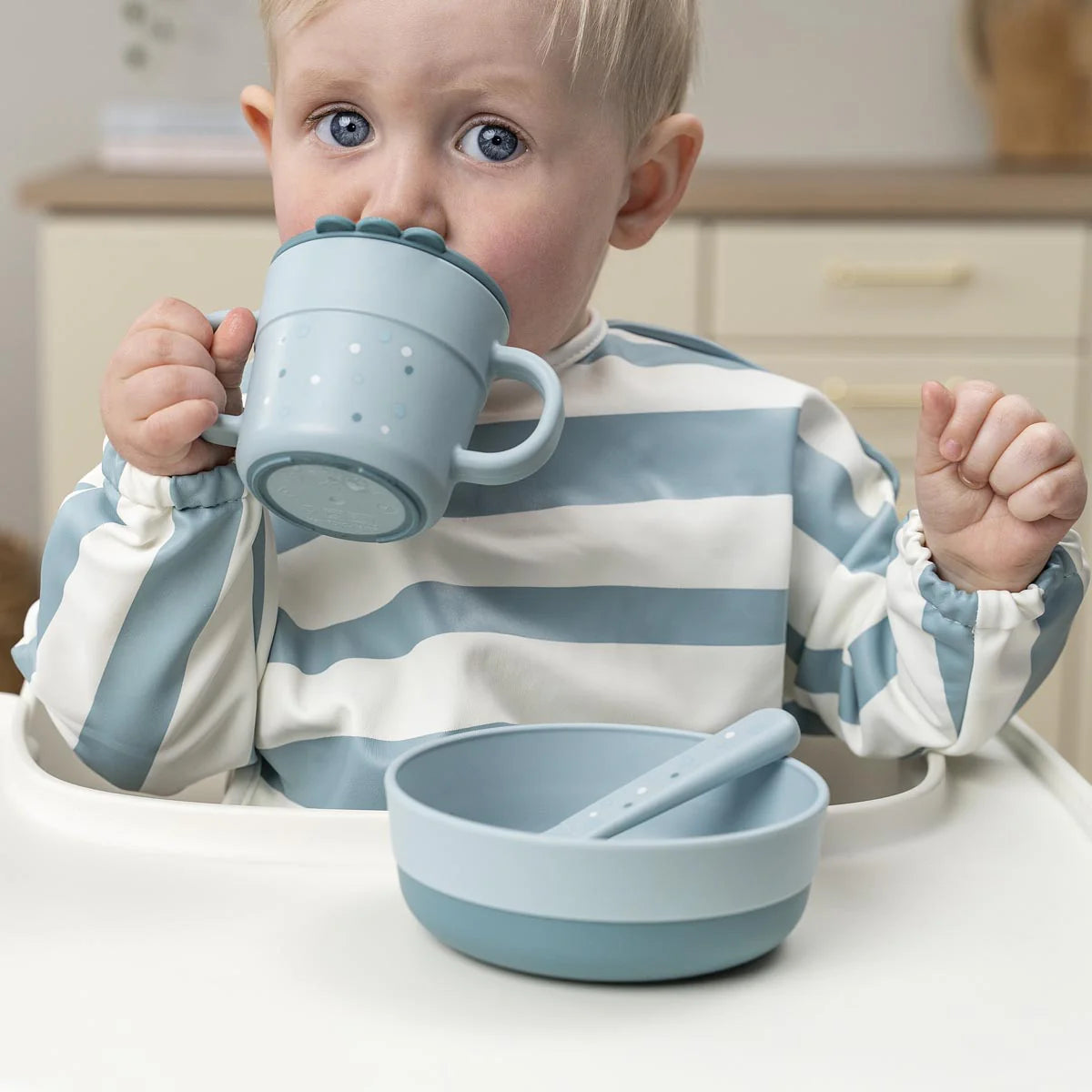 Done by Deer Sleeved Pocket Bib Striped SAND - Tiny Tots Baby Store