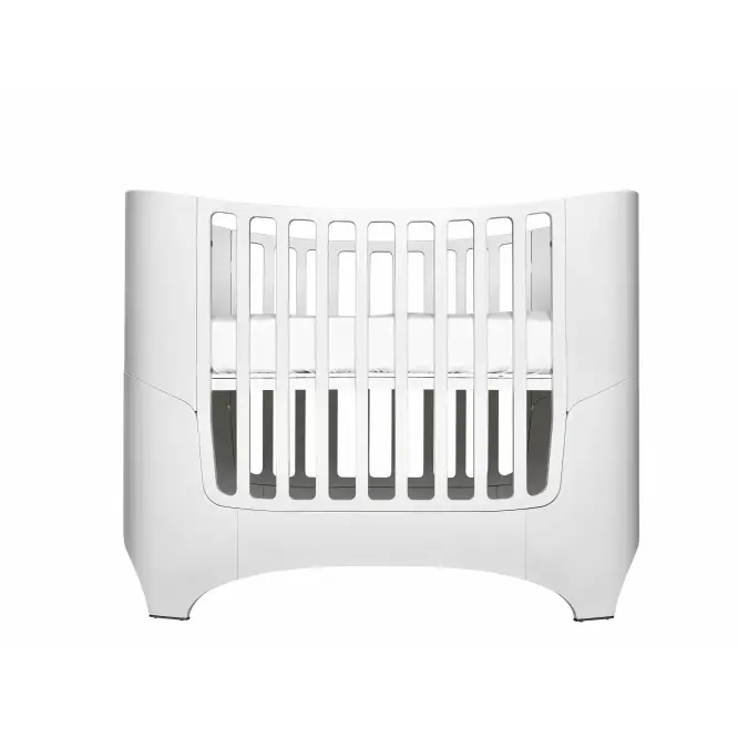 White modern Leander Classic Cot in a nursery with Toshi Baby Romper and baby strollers