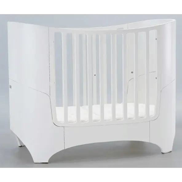 White rounded baby crib from Leander Classic Cot for modern nurseries with Toshi Baby Romper