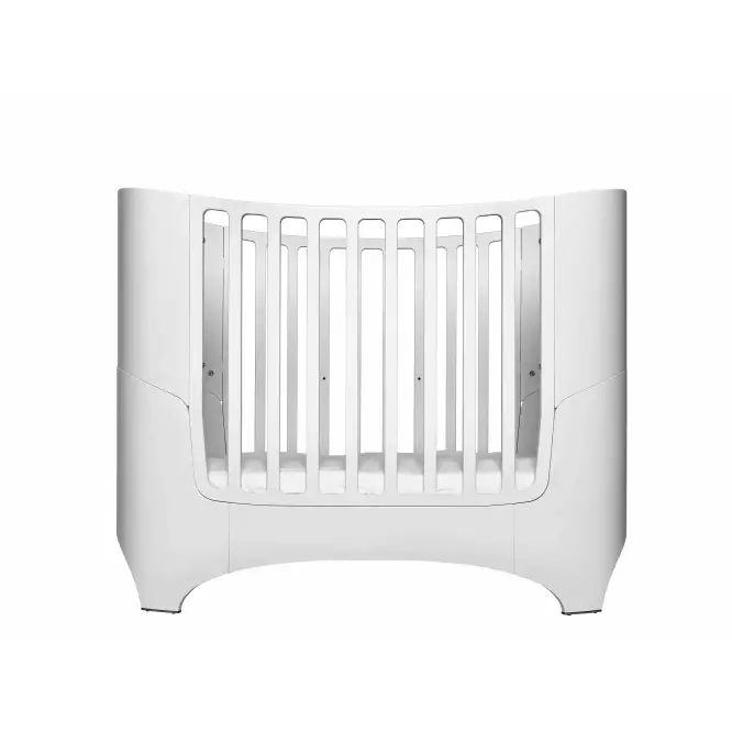 Modern white Leander Classic Cot in a nursery with Toshi Baby Romper and Odyssey Wagon Wheels