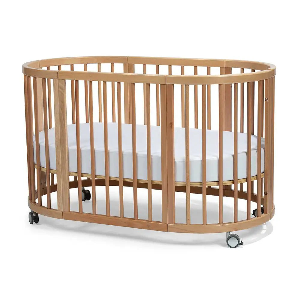 Oval wooden Lolli Sprout Cot with wheels made of Toshi Baby European Beech Wood