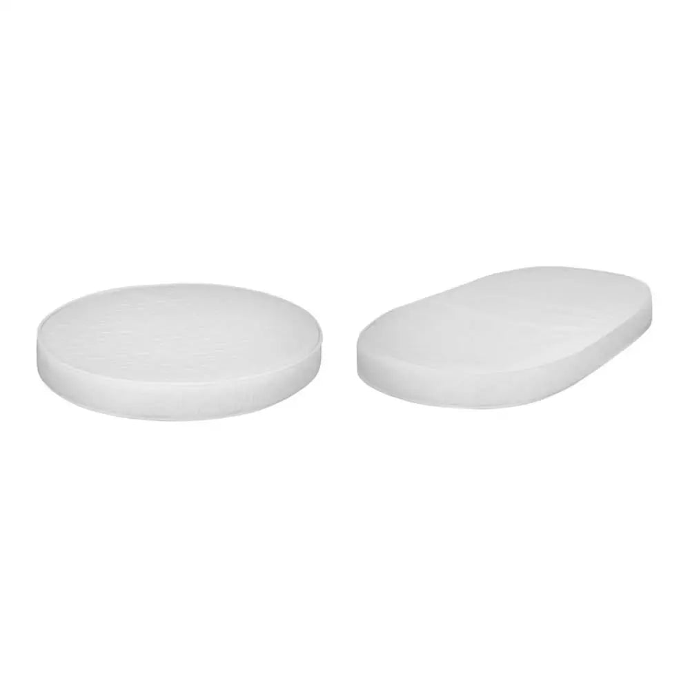 Two white rounded tablets from Cocoon Nest Lolli 4-in-1 Mattress for baby comfort