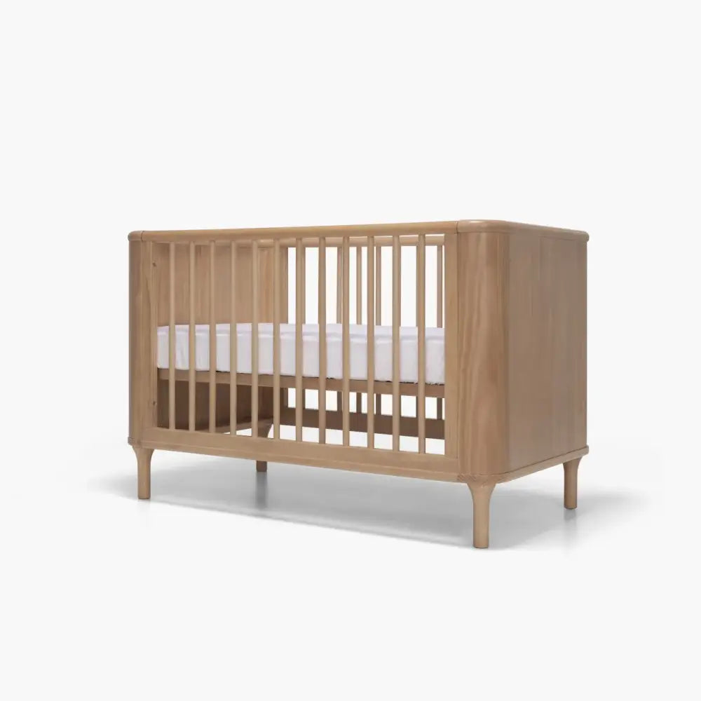 Wooden baby crib with mattress from Tasman Eco Willow 3 Pc Package, perfect for nursery