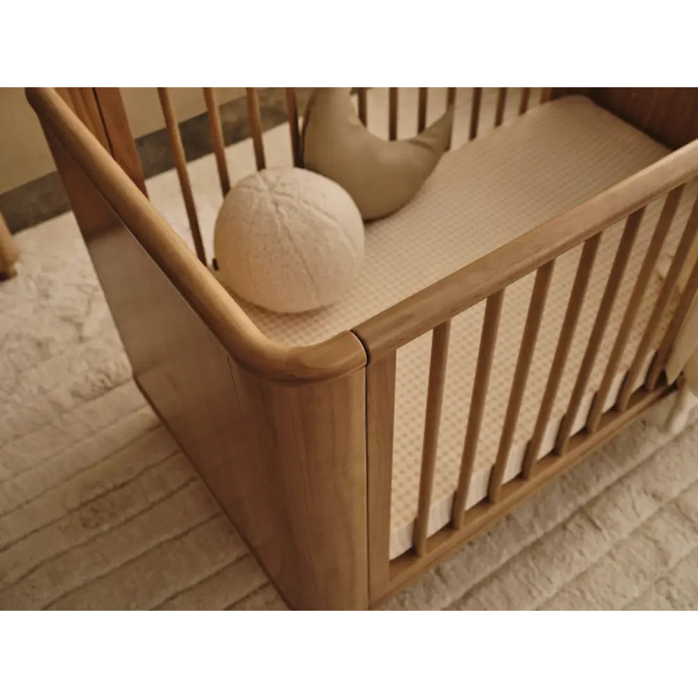 Wooden baby crib from Tasman Eco Willow with pocket spring mattress and willow 3-drawer chest