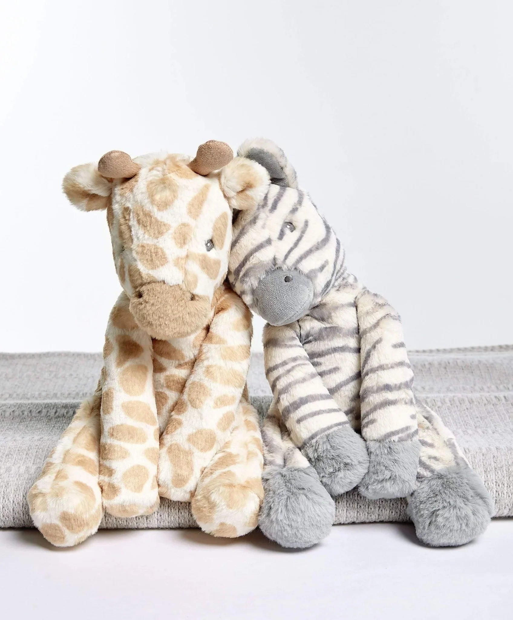 Stuffed giraffe and zebra toys from Mamas & Papas Welcome to the World Zebra soft toy, perfect for baby strollers or toshi baby rompers