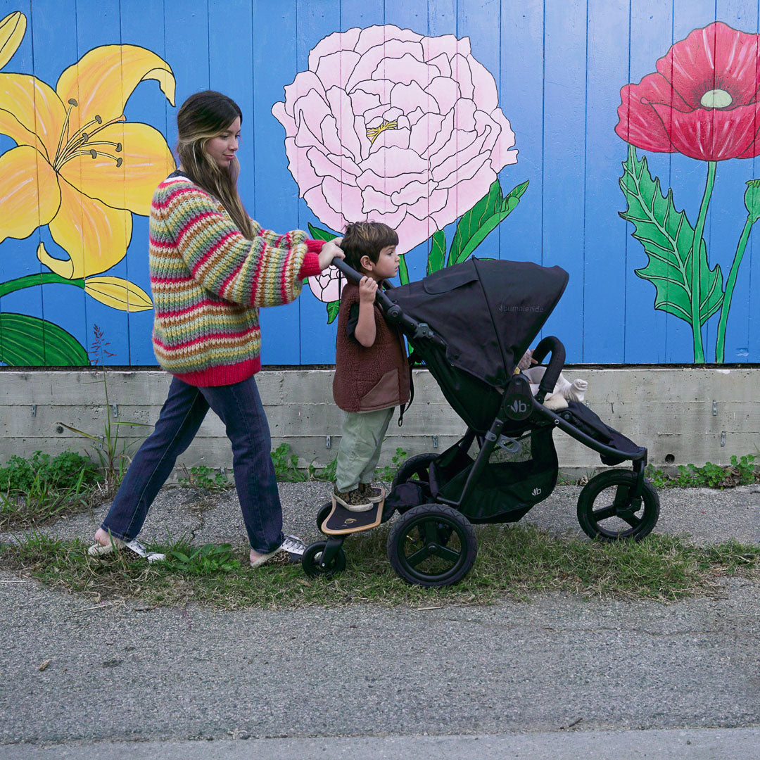 Black Bumbleride Indie Stroller with ride-along board and Odyssey wagon wheels