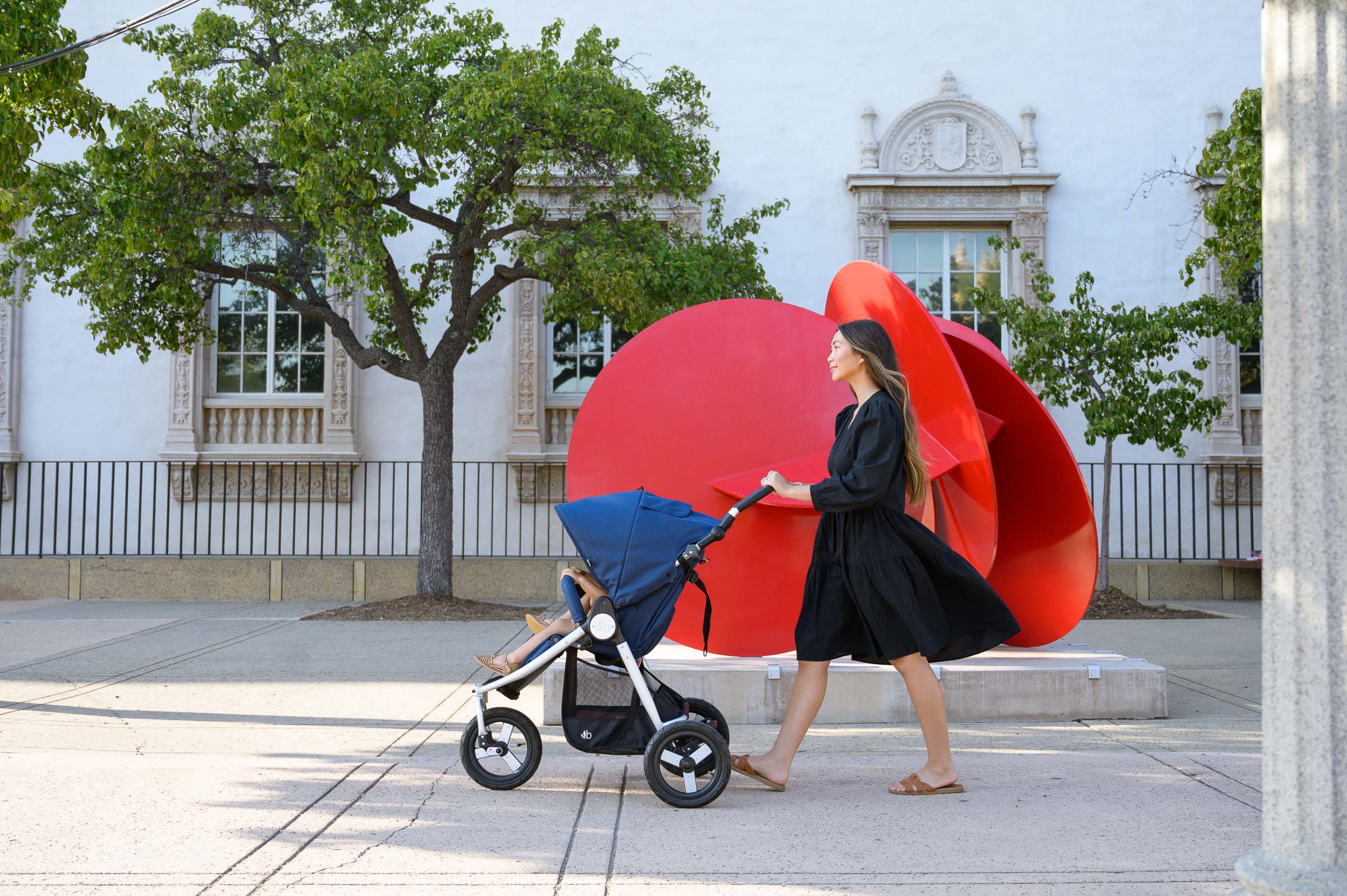 Silver Bumbleride Indie Stroller with blue canopy for stylish baby strollers and Toshi Baby Romper pics