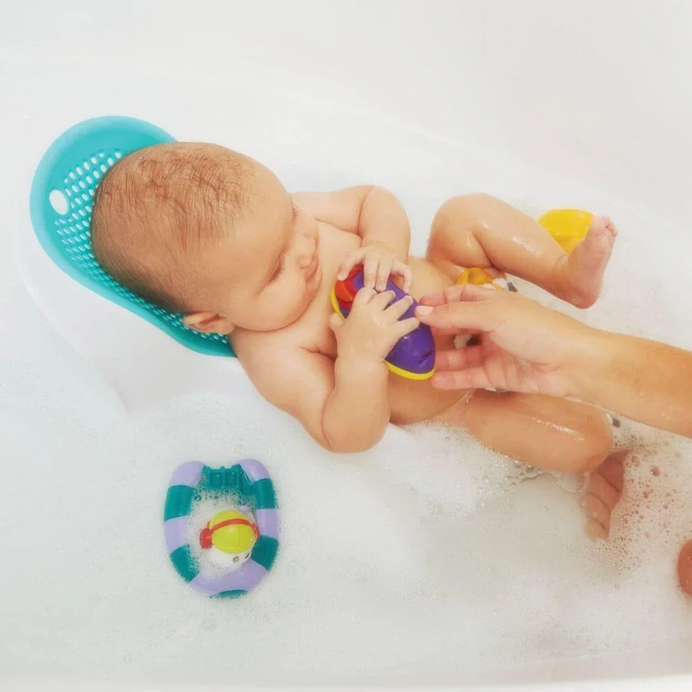 Baby in bath with toys using Angelcare Bath Support Fit, perfect for toshi baby bath