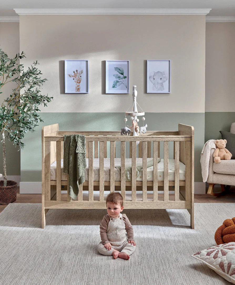 Wooden baby crib from Mamas&Papas Atlas 4 Piece Set in light oak style for toshi baby
