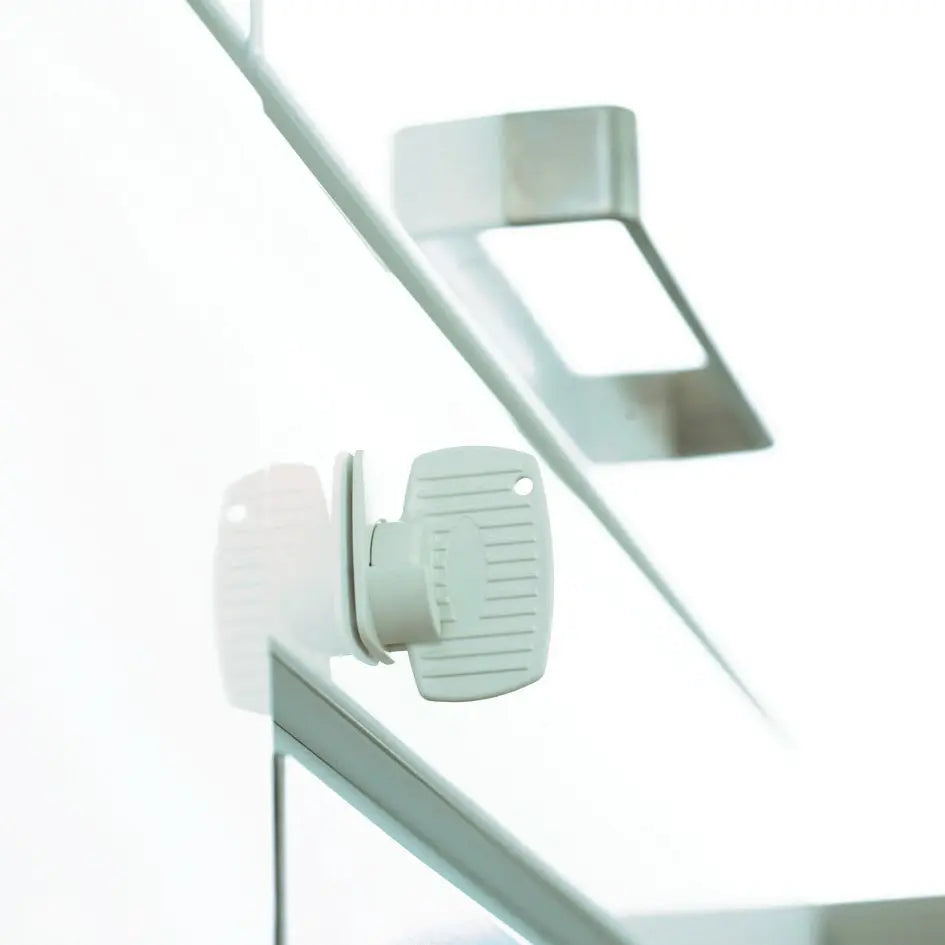 White plastic window lock from BabyDan Magnetic Drawer and Cupboard Lock for safety