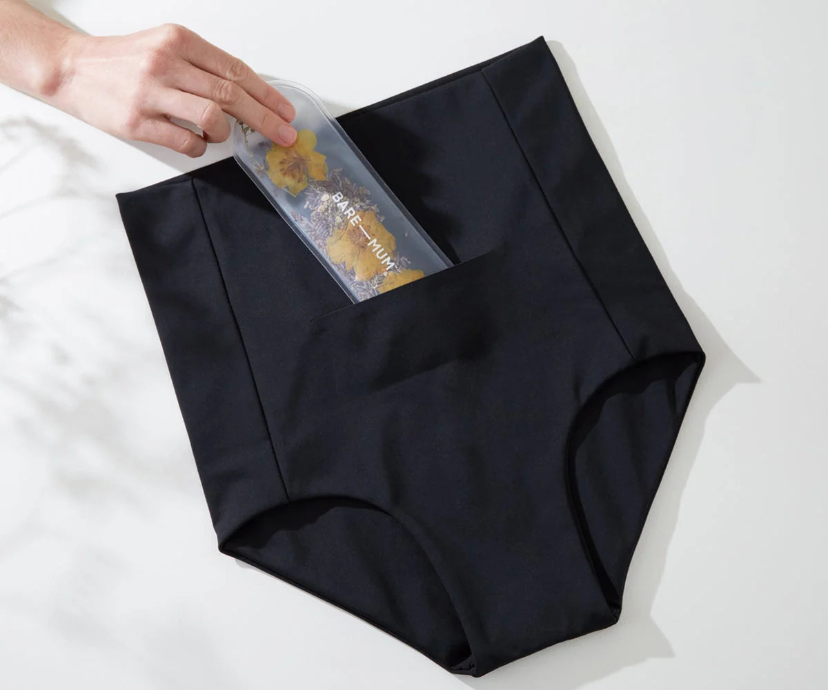 Black high-waisted underwear with pocket from Bare Mum Postpartum briefs, perfect for Toshi Baby Romper and baby strollers