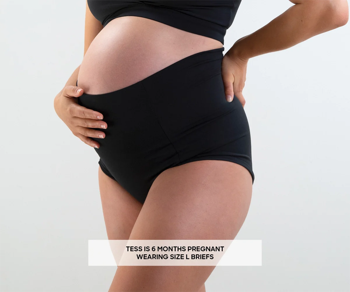 Pregnant woman in black maternity briefs showcasing Bare Mum Postpartum briefs style