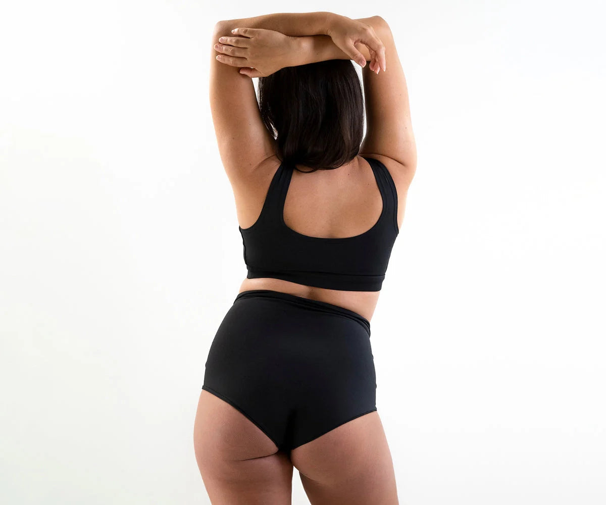 Black sports bra and high-waisted briefs from Bare Mum Postpartum collection, comfy for new moms