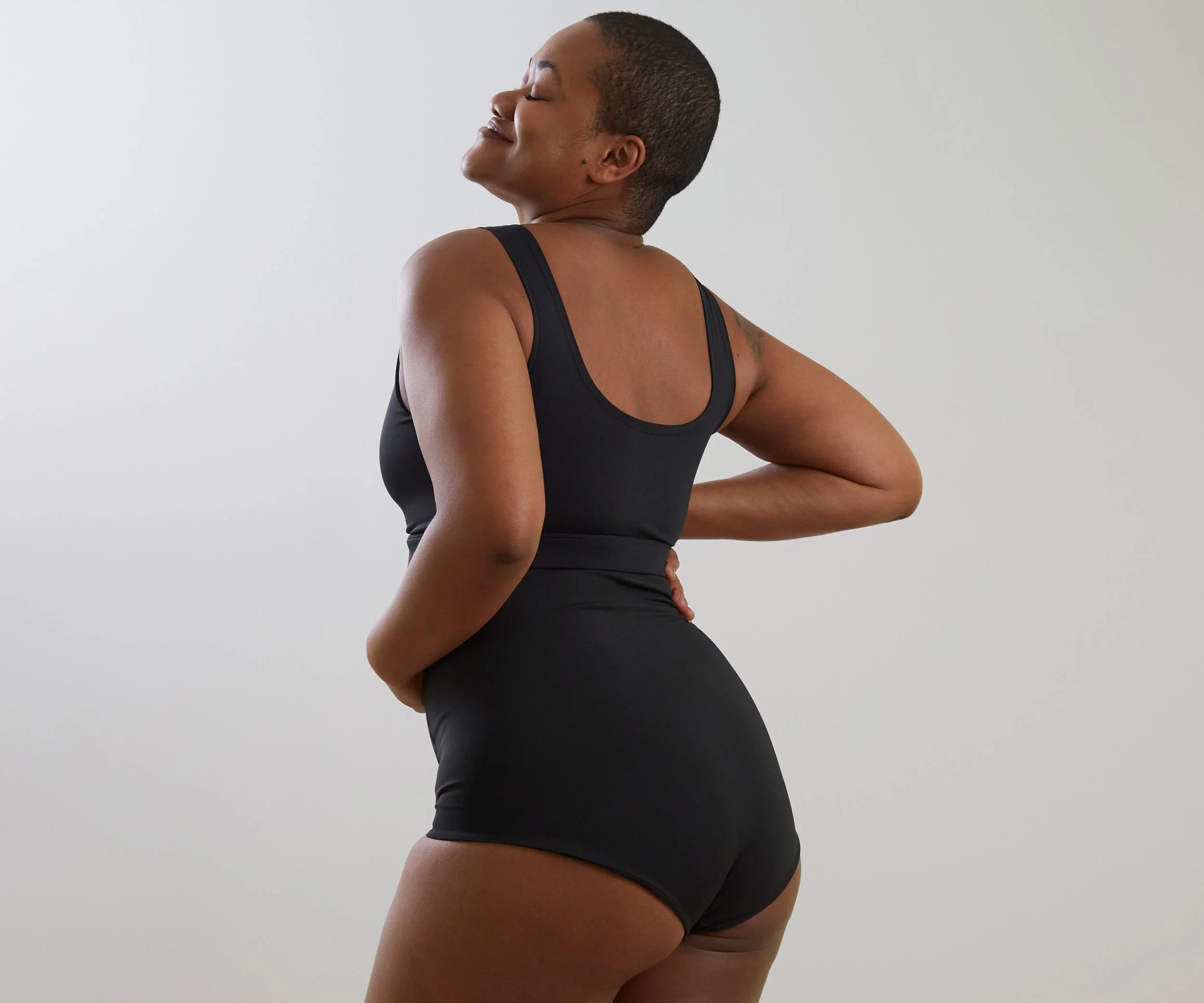 Black one-piece swimsuit from Bare Mum Postpartum collection, perfect with Toshi Baby Romper and baby strollers