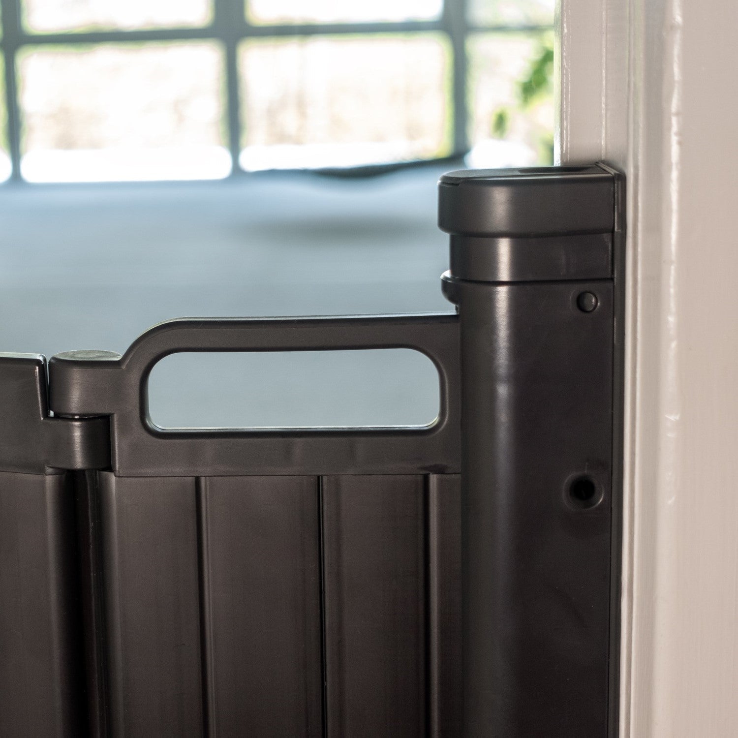 Dark gray plastic safety gate from BabyDan Guard Me Gate Black, perfect retractable baby gate