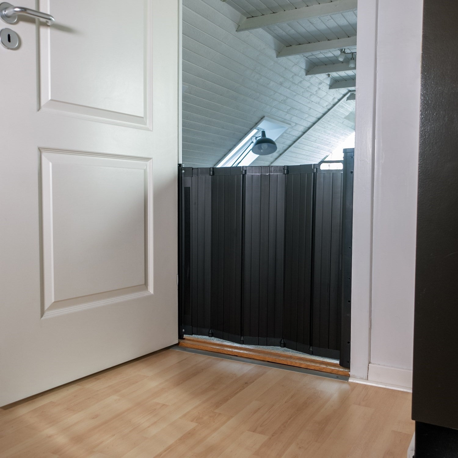 Black accordion-style safety gate from BabyDan Guard Me, perfect retractable baby gate option