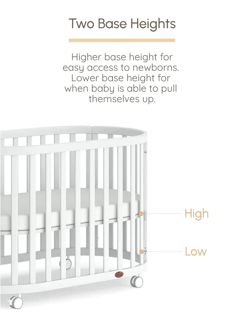 White boori eden oval crib with adjustable base and pocket spring mattress for perfect sleep