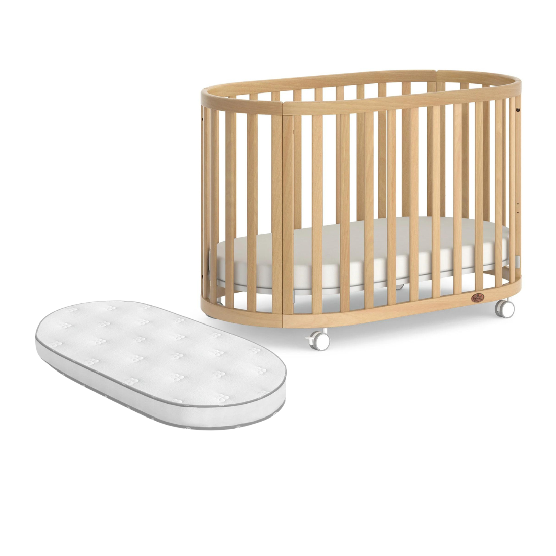 Oval wooden Boori Eden Oval cot with pocket spring mattress for Toshi baby toddler bed
