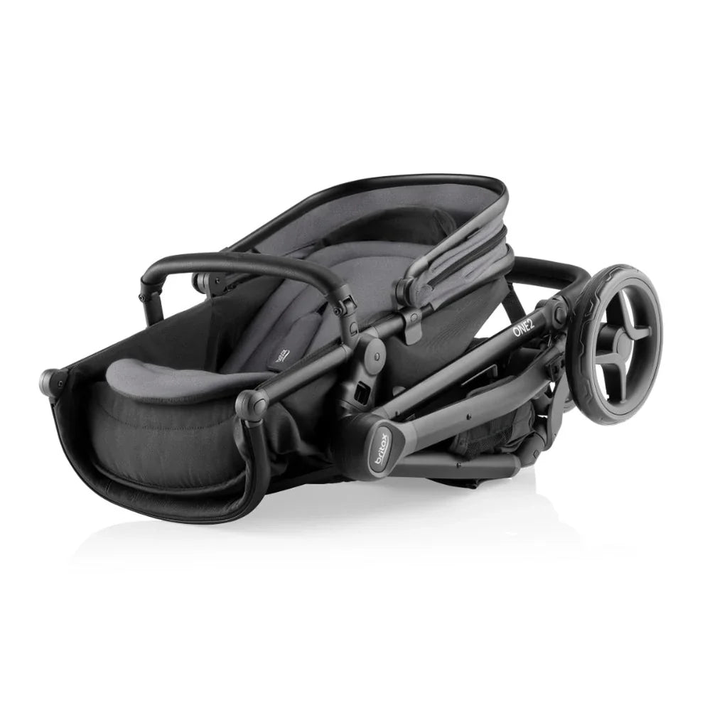 Folded black Britax One2 stroller, a compact tandem stroller for baby strollers needs