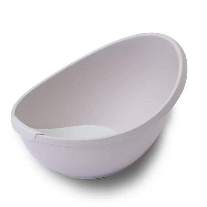White plastic baby bathtub with newborn support insert for Bubble Cuddle Bath Toshi Baby