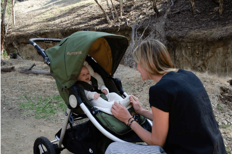 Green baby stroller with Bumbleride Organic Cotton Infant Insert, perfect for eco-friendly baby strollers