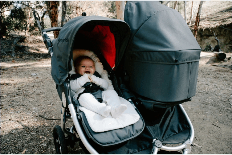 Double stroller with baby using Bumbleride Organic Cotton Infant Insert for comfy rides
