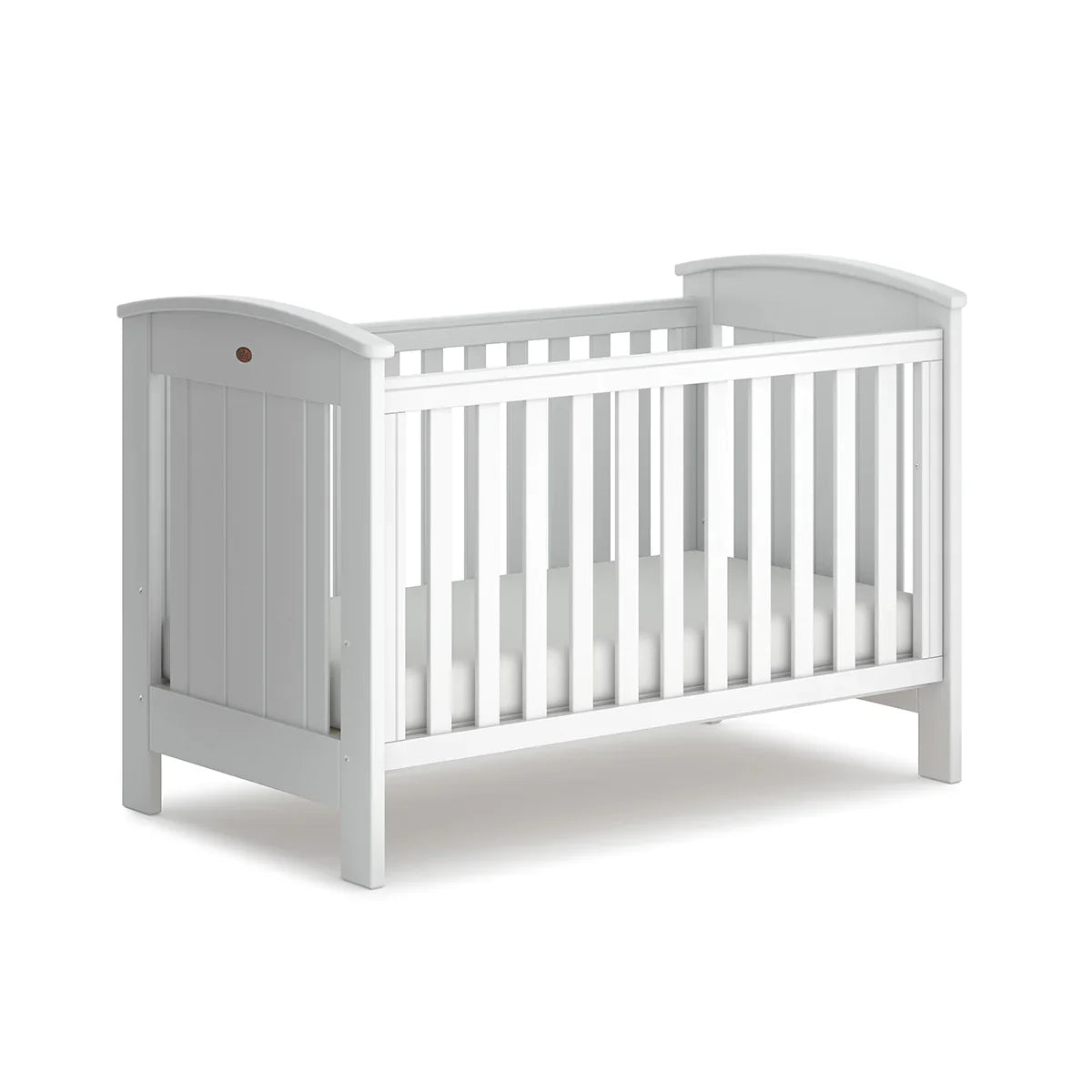 White wooden casa baby cot with dropside design, perfect for cozy nurseries