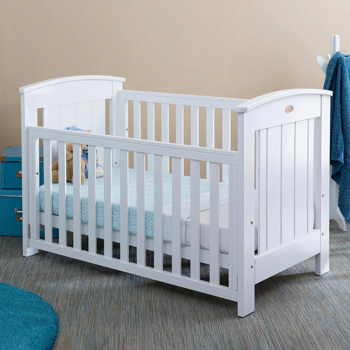 White wooden Boori Casa Baby Cot with dropside, perfect for baby strollers and nursery