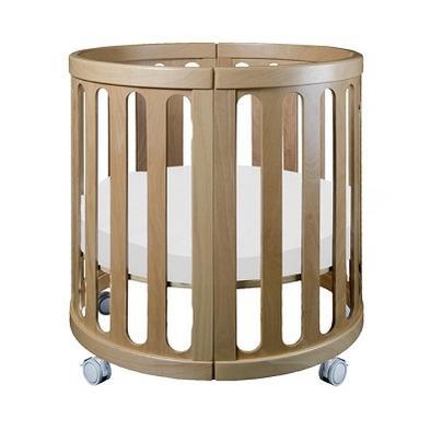 Round wooden baby crib with wheels from Cocoon Nest Natural, perfect as a junior bed