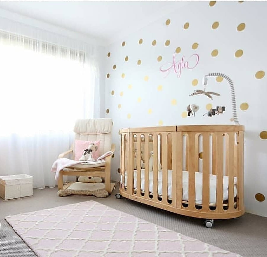 Wooden baby crib with mobile from Cocoon Nest Natural, perfect for your little junior bed