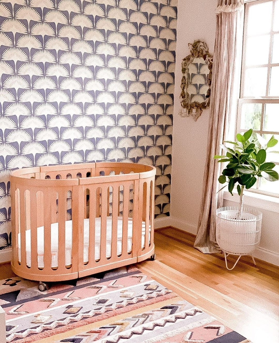 Oval wooden baby crib from Cocoon Nest Natural, perfect as a junior bed or with baby strollers