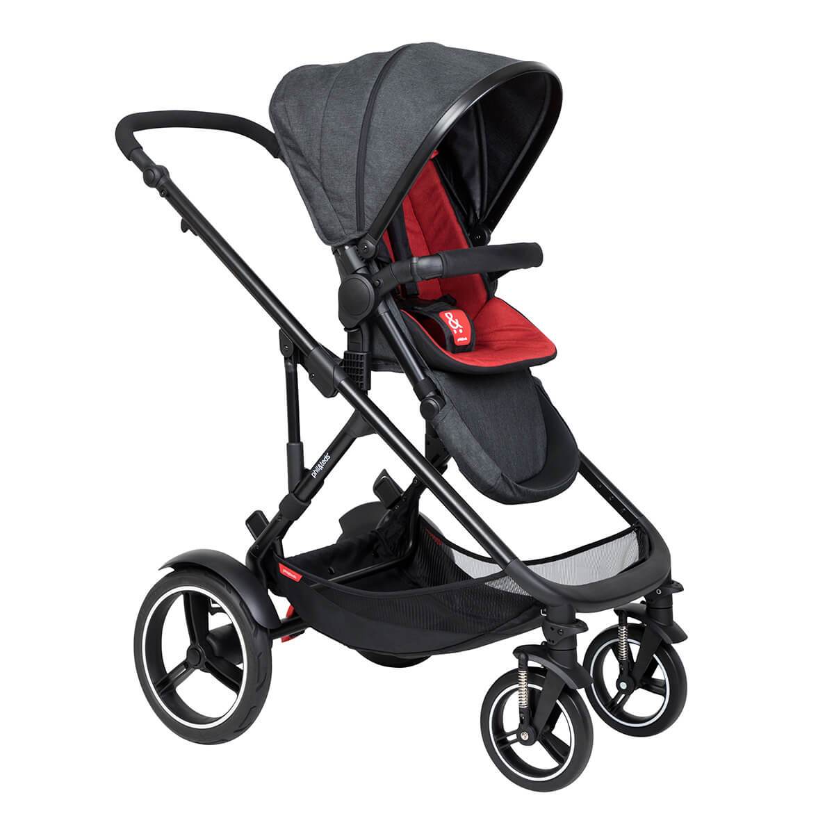 Black and red baby stroller from Phil&Teds Voyager with Odyssey wagon wheels in action