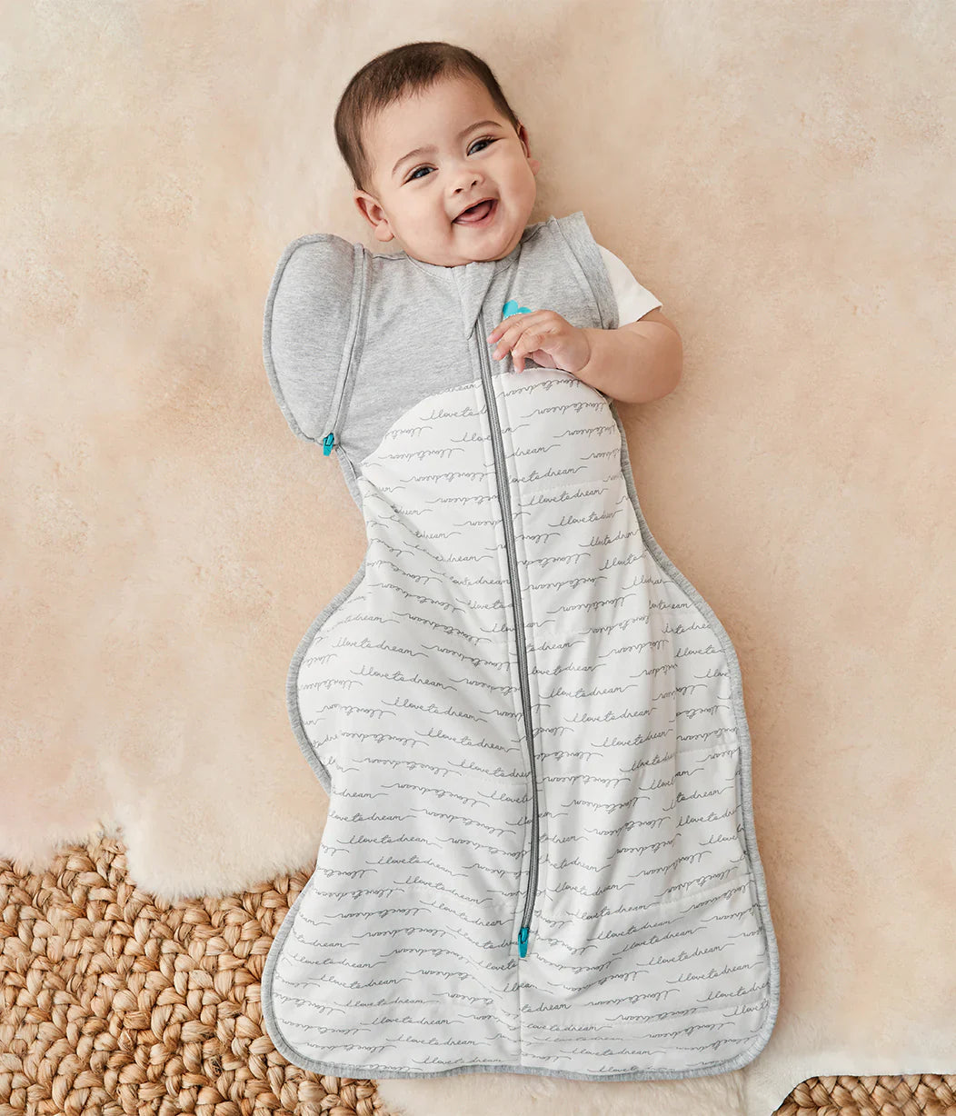 Cute baby in gray and white swaddle from Love To Dream Swaddle Up Transition Bag 2.5 TOG
