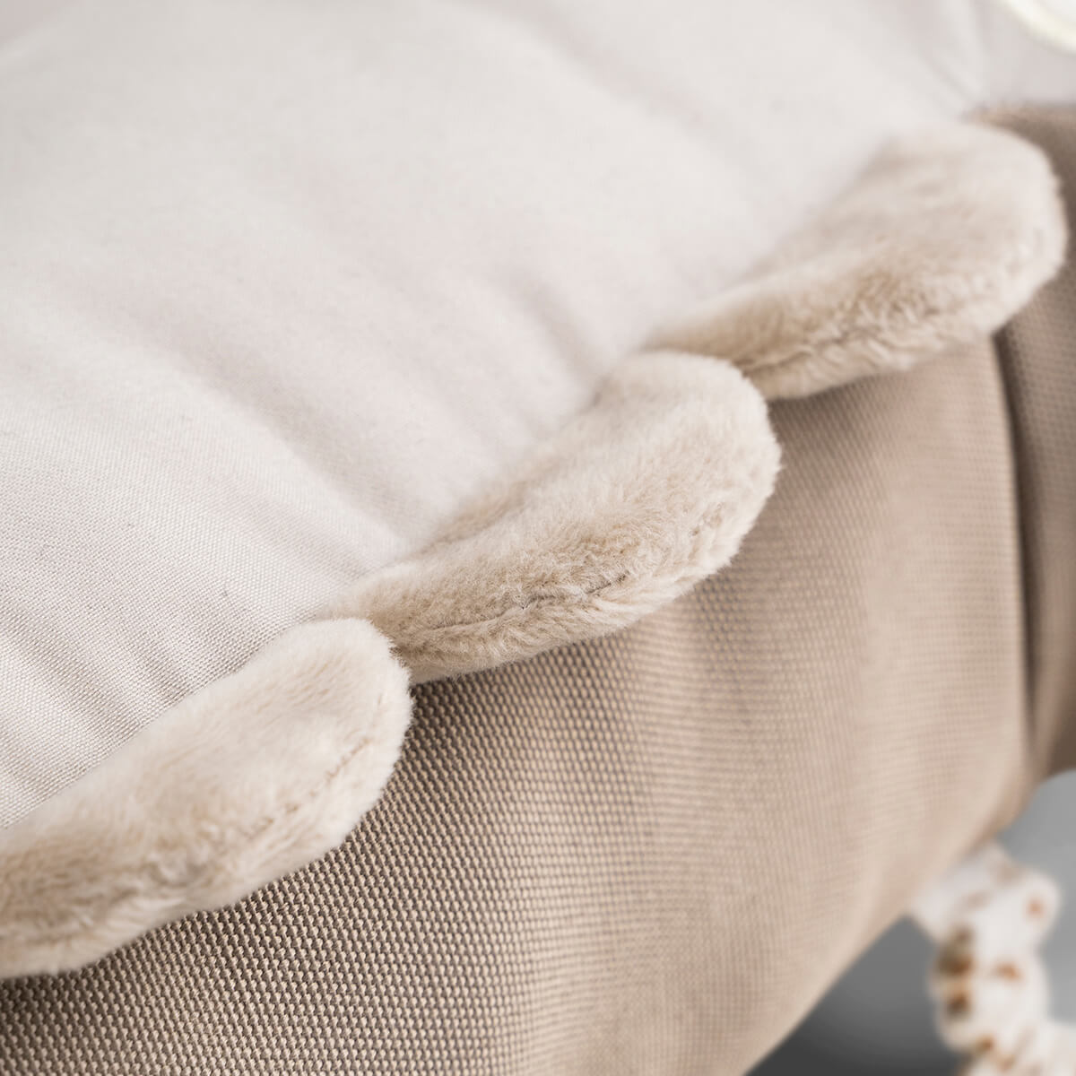 Neutral-toned cushion with fluffy trim from Deer Croco croco tummy toy collection