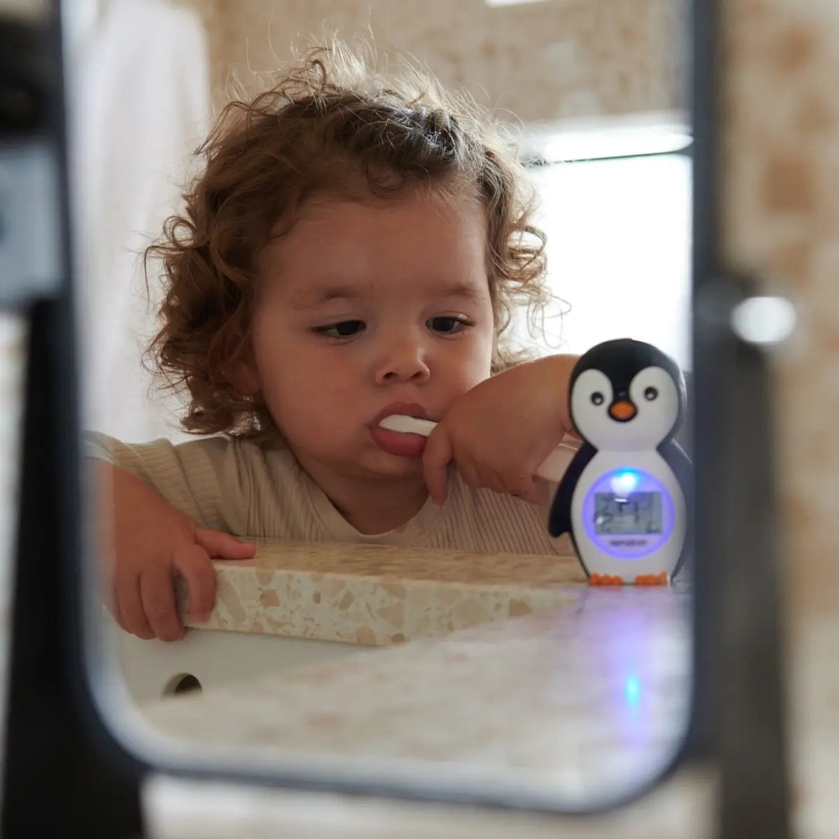Penguin-shaped toothbrush timer on Mininor Bath Thermometer for fun brushing time