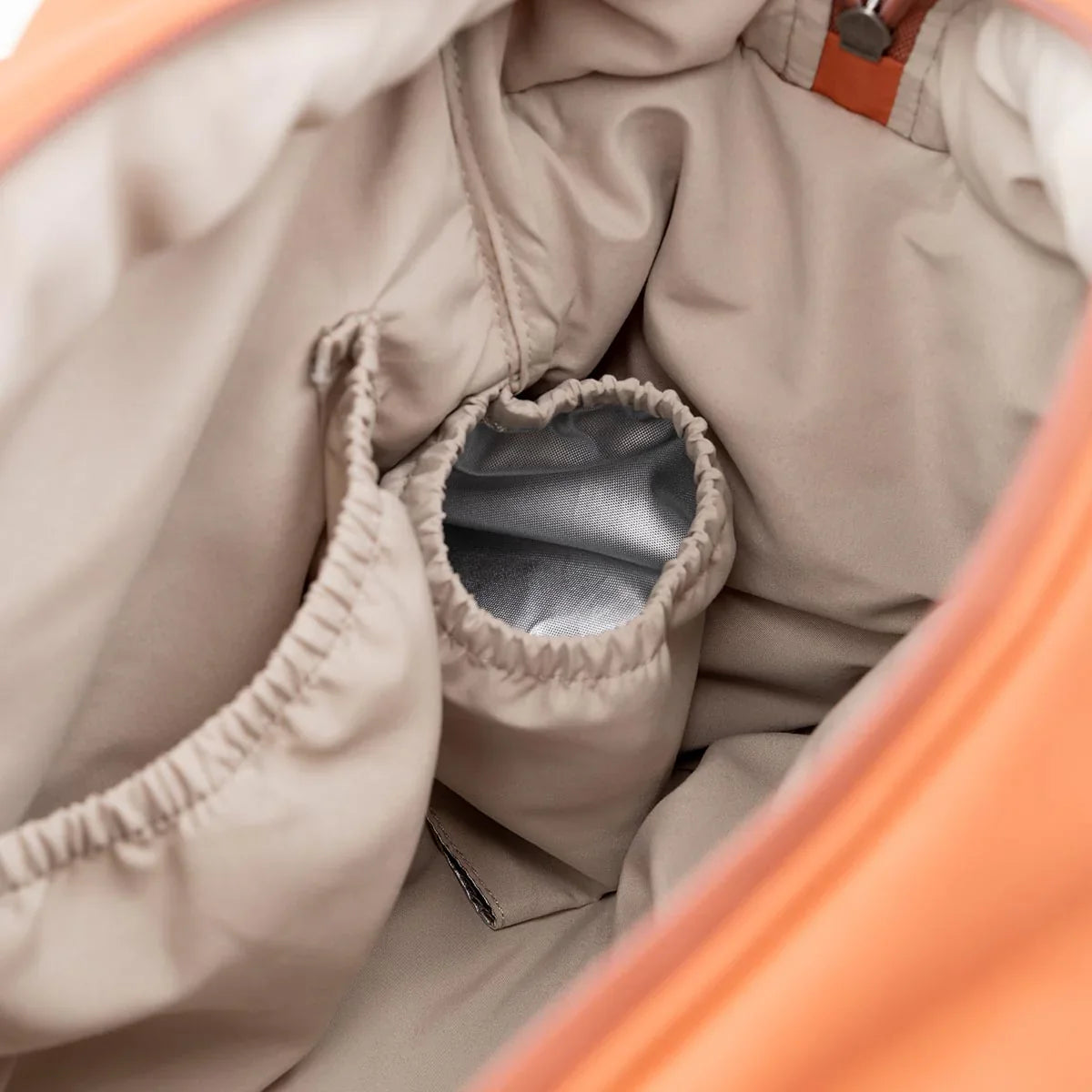 Open orange deer quilted changing bag with exterior zip closure and interior pockets for baby strollers