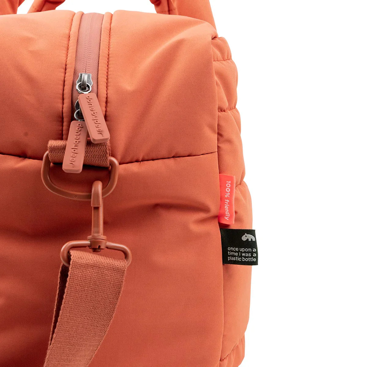 Orange quilted duffel bag with exterior zip closure perfect for baby strollers and deer quilted changing needs