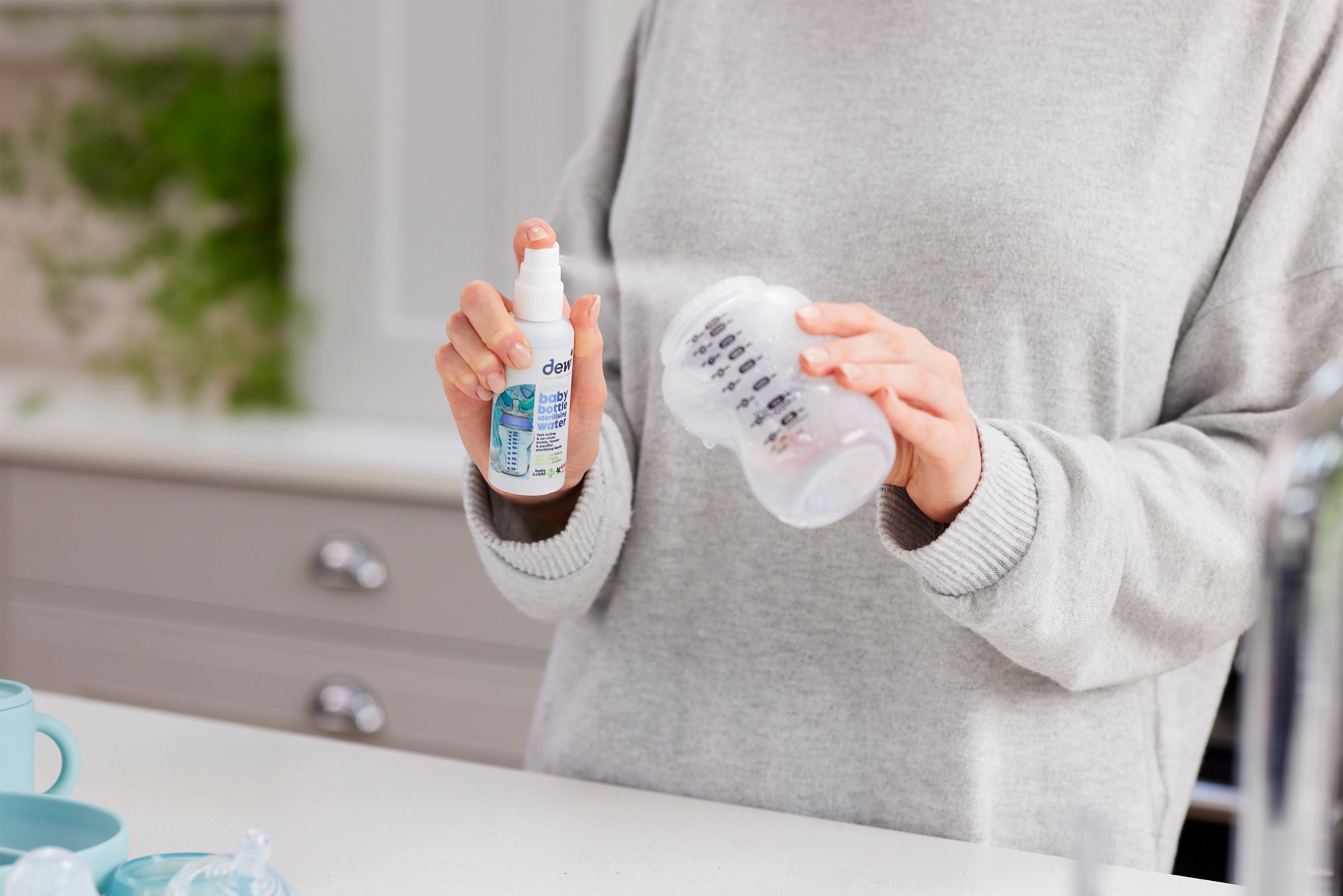 Baby bottles and strollers get clean with Dew Baby Bottle Sterilising Water 65ml spray