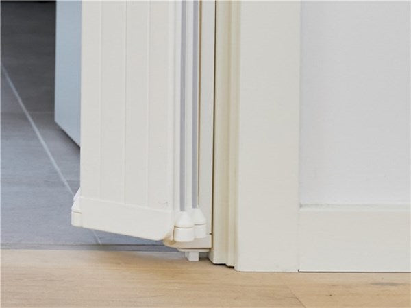 DogSpace Marley retractable guard featuring sleek white folding dog gate door frame