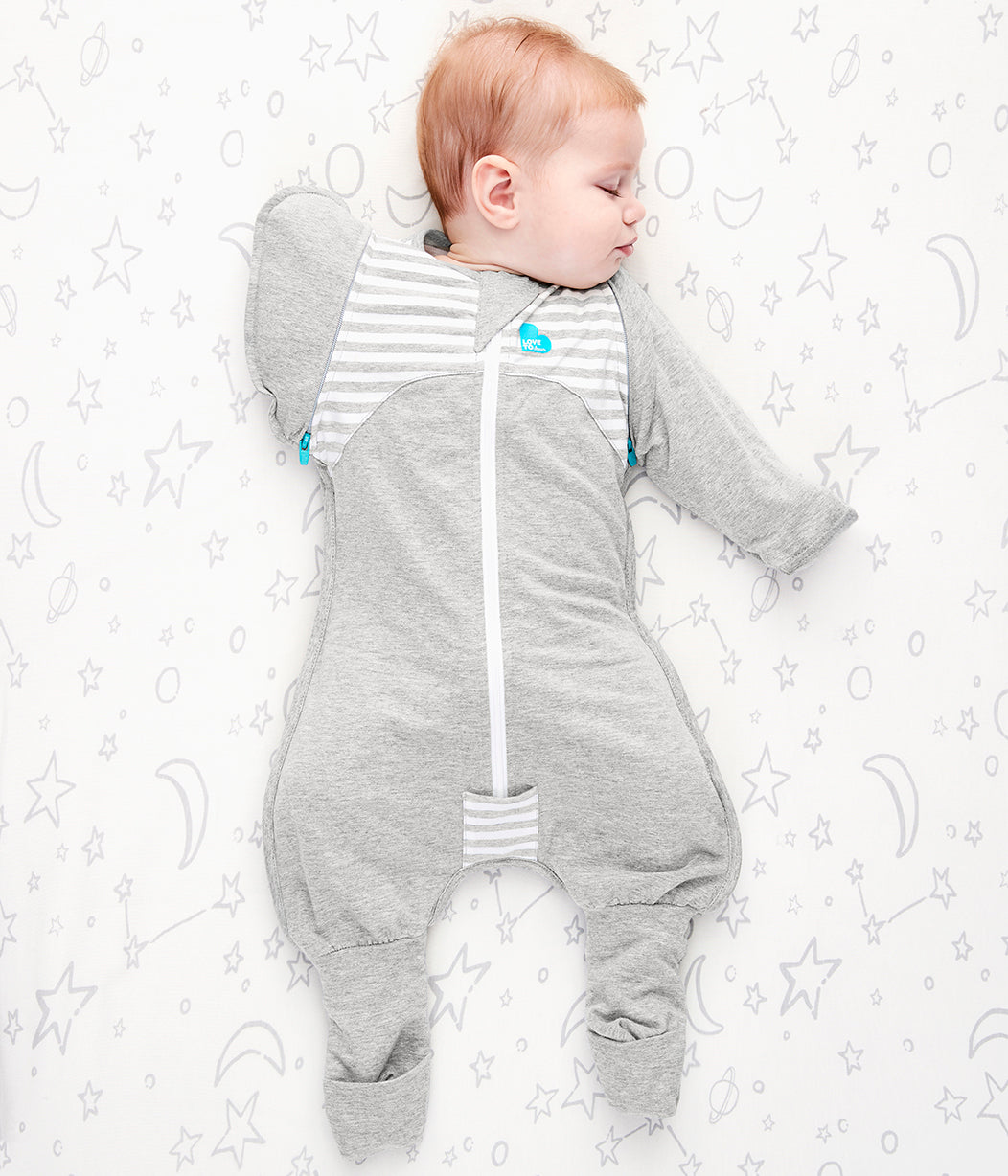 Baby in gray sleepsuit from Love To Dream Swaddle Transition Suit Original 1.0 Tog for toshi baby and baby strollers