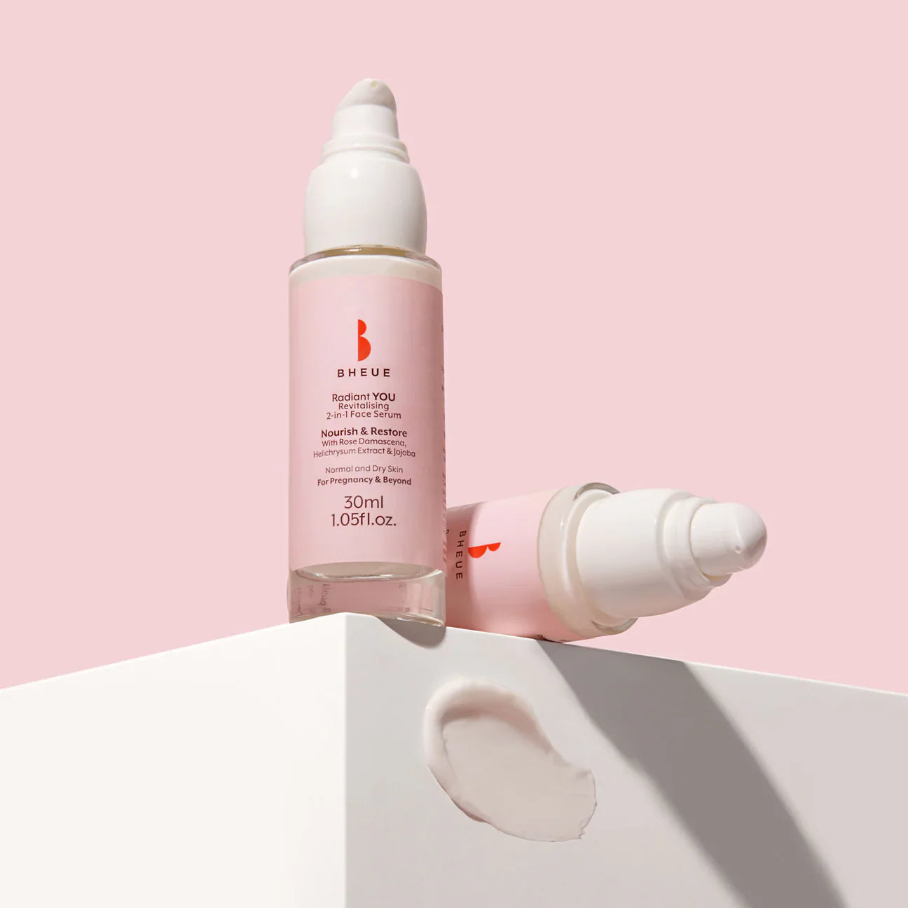 Pink and white serum bottles for Bheue Radiant You Revitalising 2 In 1 Face Serum with helichrysum stoechas extract