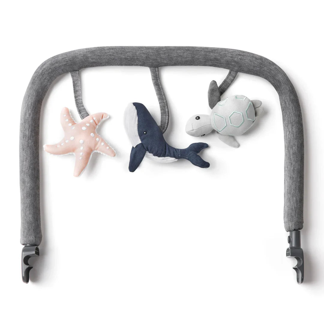 Gray baby activity gym with plush sea creatures from Ergobaby Evolve Ocean Wonders