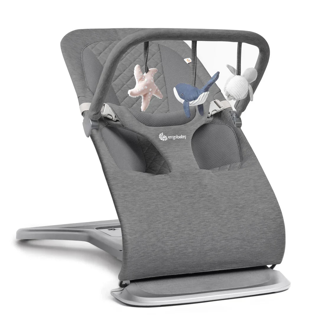 Gray baby bouncer with hanging toys from Ergobaby Evolve Ocean Wonders ultimate bouncer toy