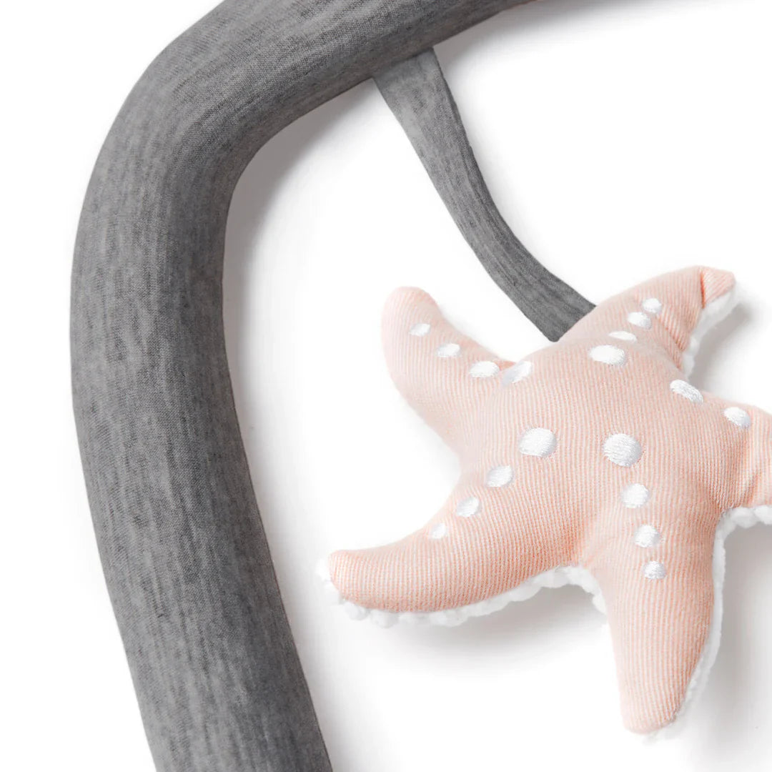 Pink starfish plush toy from Ergobaby Evolve Ocean Wonders Bouncer Toy Bar
