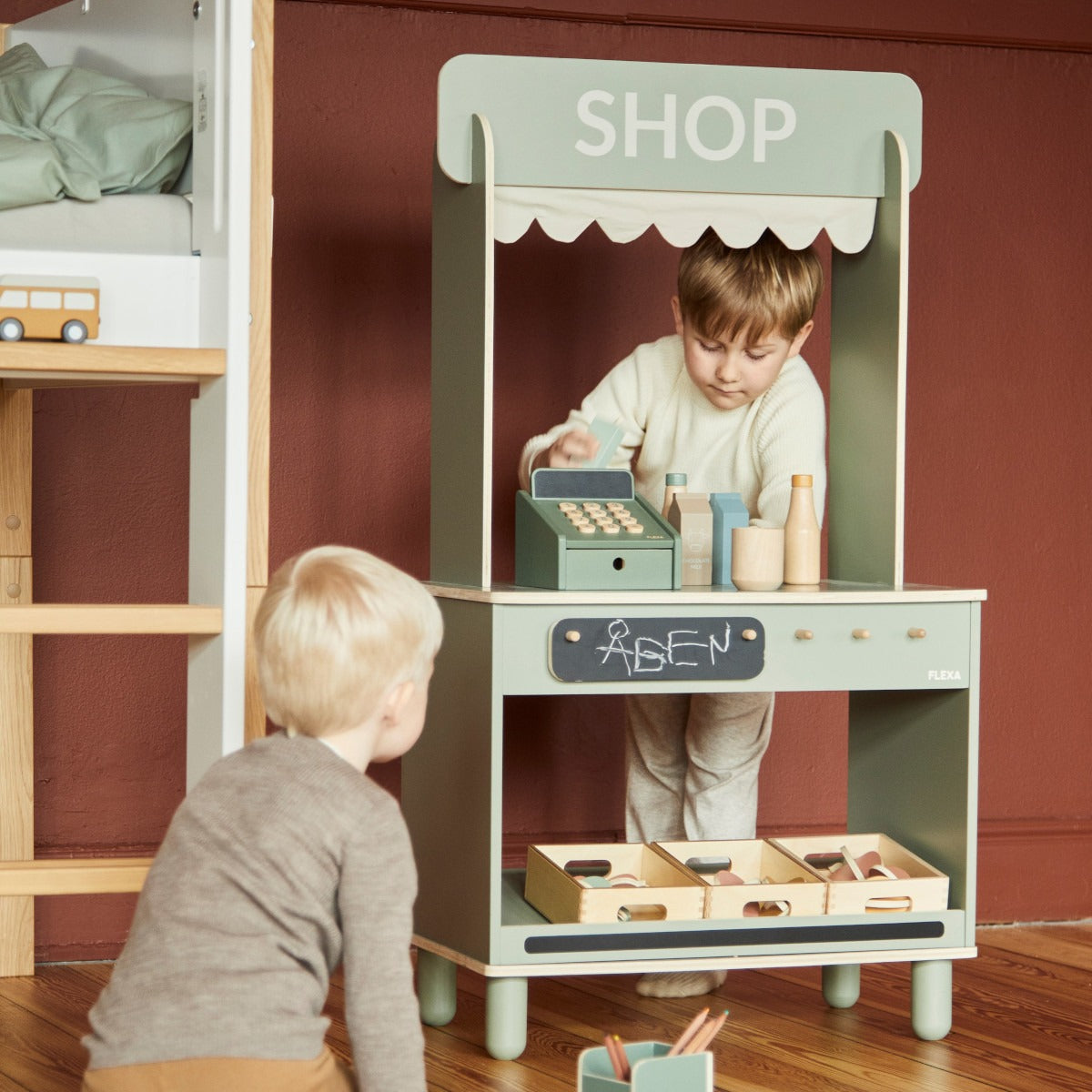 Wooden toy shop with accessories from Flexa Shop and Cafe, perfect for baby strollers