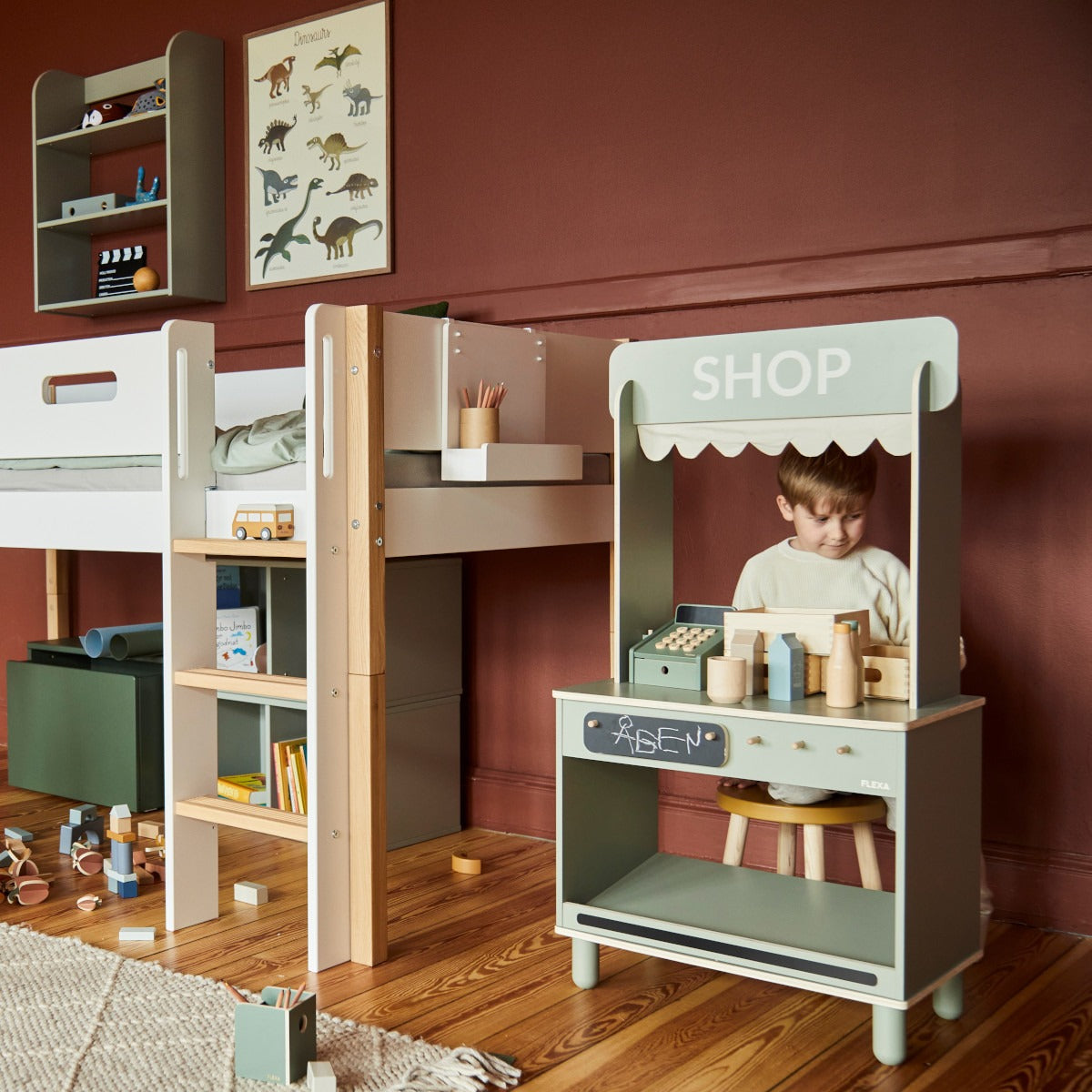 Wooden children’s play shop from Flexa Shop and Cafe with Toshi baby romper and Odyssey wagon wheels