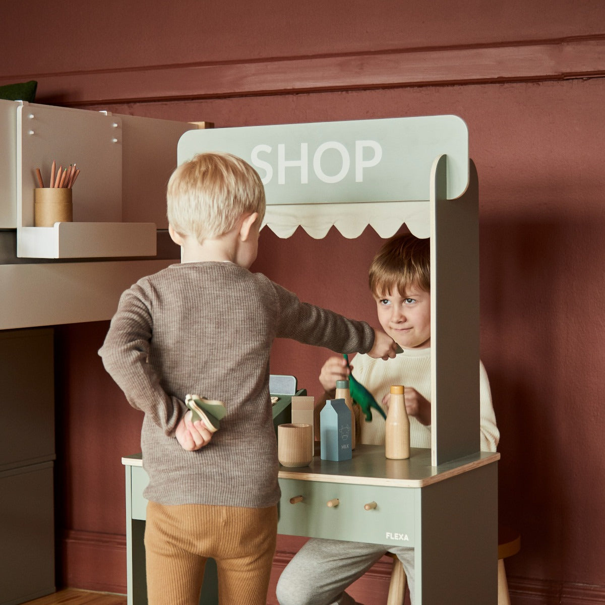 Kids playing in Flexa Shop and Cafe with Toshi Baby Romper and Odyssey Wagon Wheels