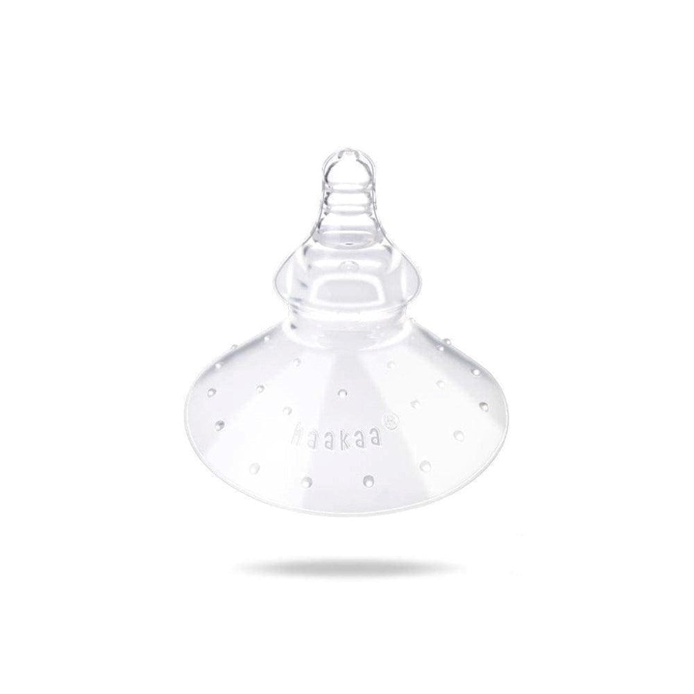 Transparent silicone nipple shield from Haakaa Breastfeeding Nipple series with Toshi baby romper
