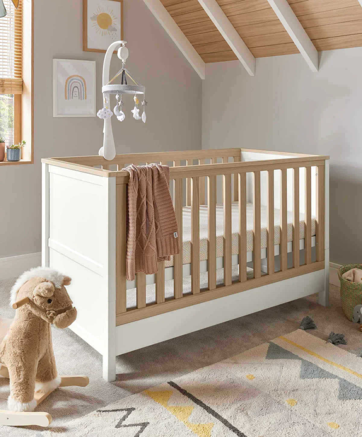 White and wood baby crib from Mamas&Papas Harwell 4 Piece Set, perfect as toddler bed