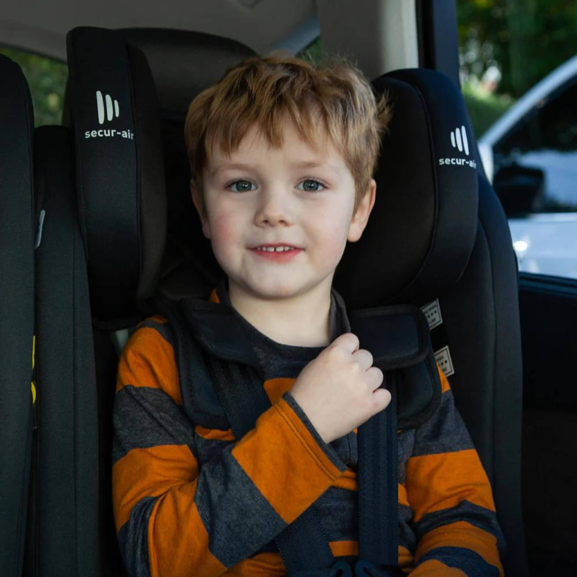 Child buckled in Infasecure ACCOMPLISH More car seat with active bamboo fabric inside